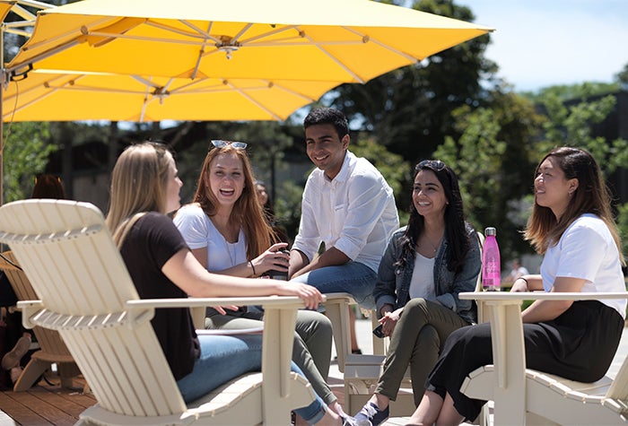 Students hanging out on campus outside