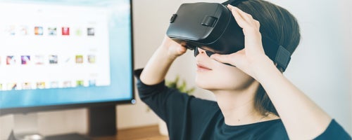 A student wearing VR goggles.