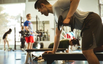 Waterloo student lifting weights.