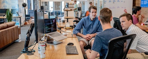 Group discussion at a desk.