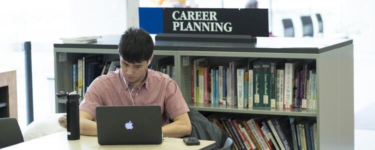 student working on laptop