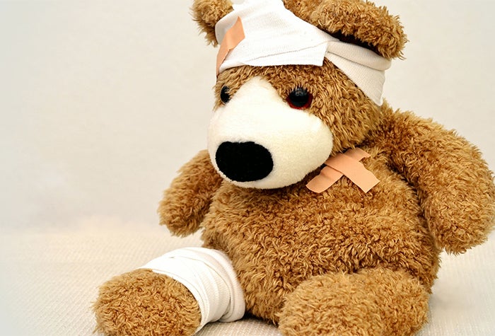 Teddy bear covered in bandages