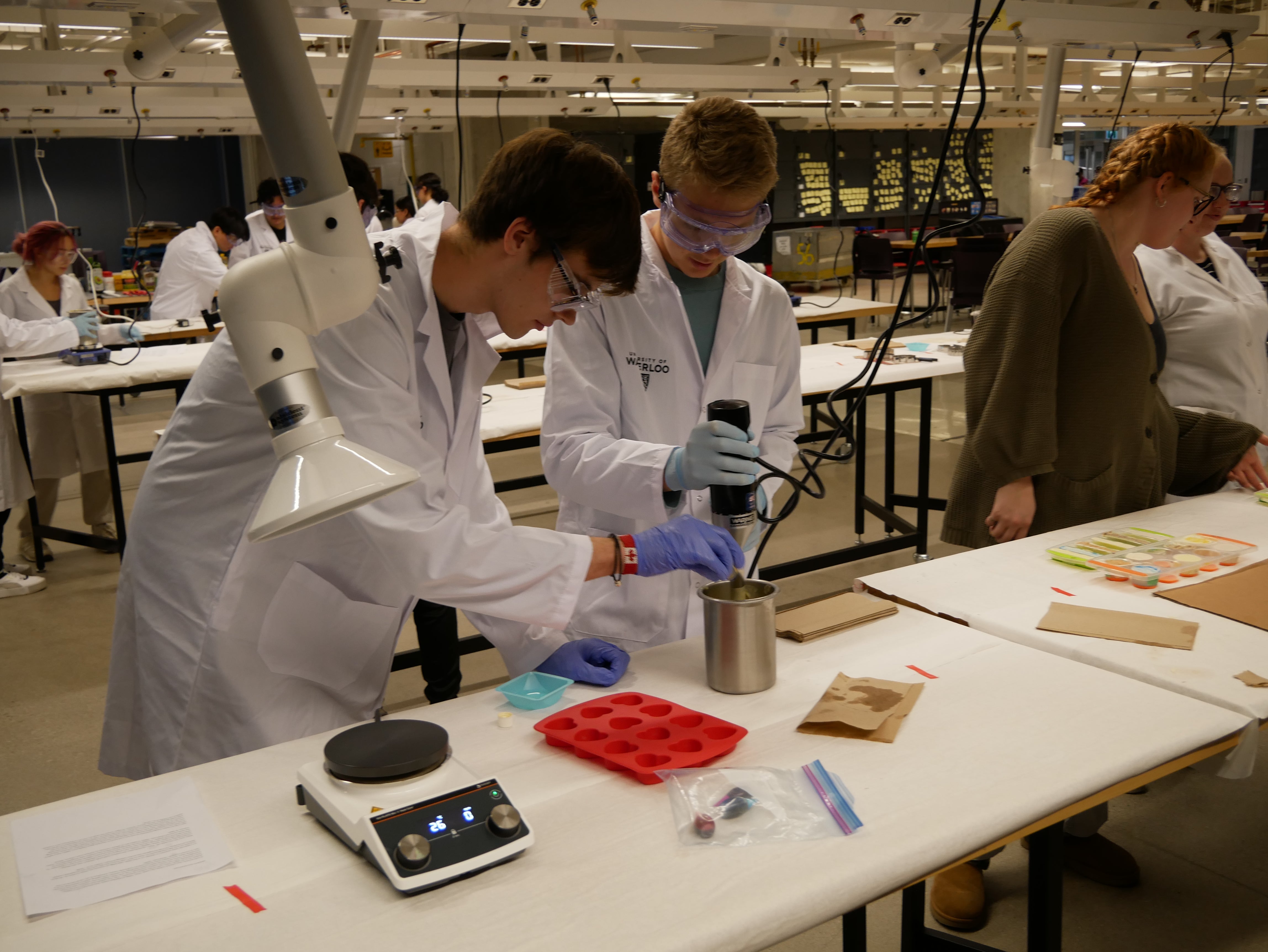 Students work in a lab with chemicals