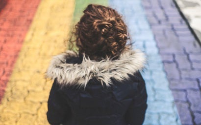 Student looking at a rainbow.