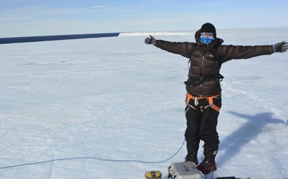 An environment student on a frozen lake.