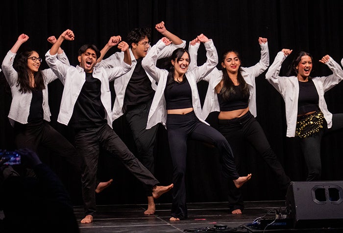 Group of dancers performing on stage