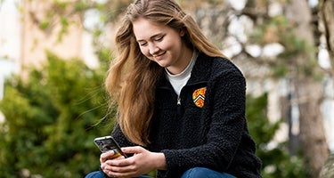 Student looking at their phone