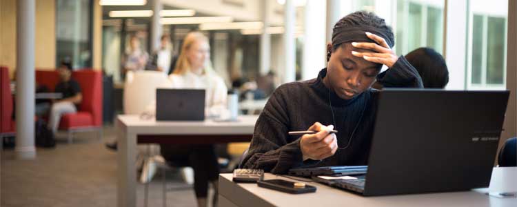Student doing schoolwork in SLC.