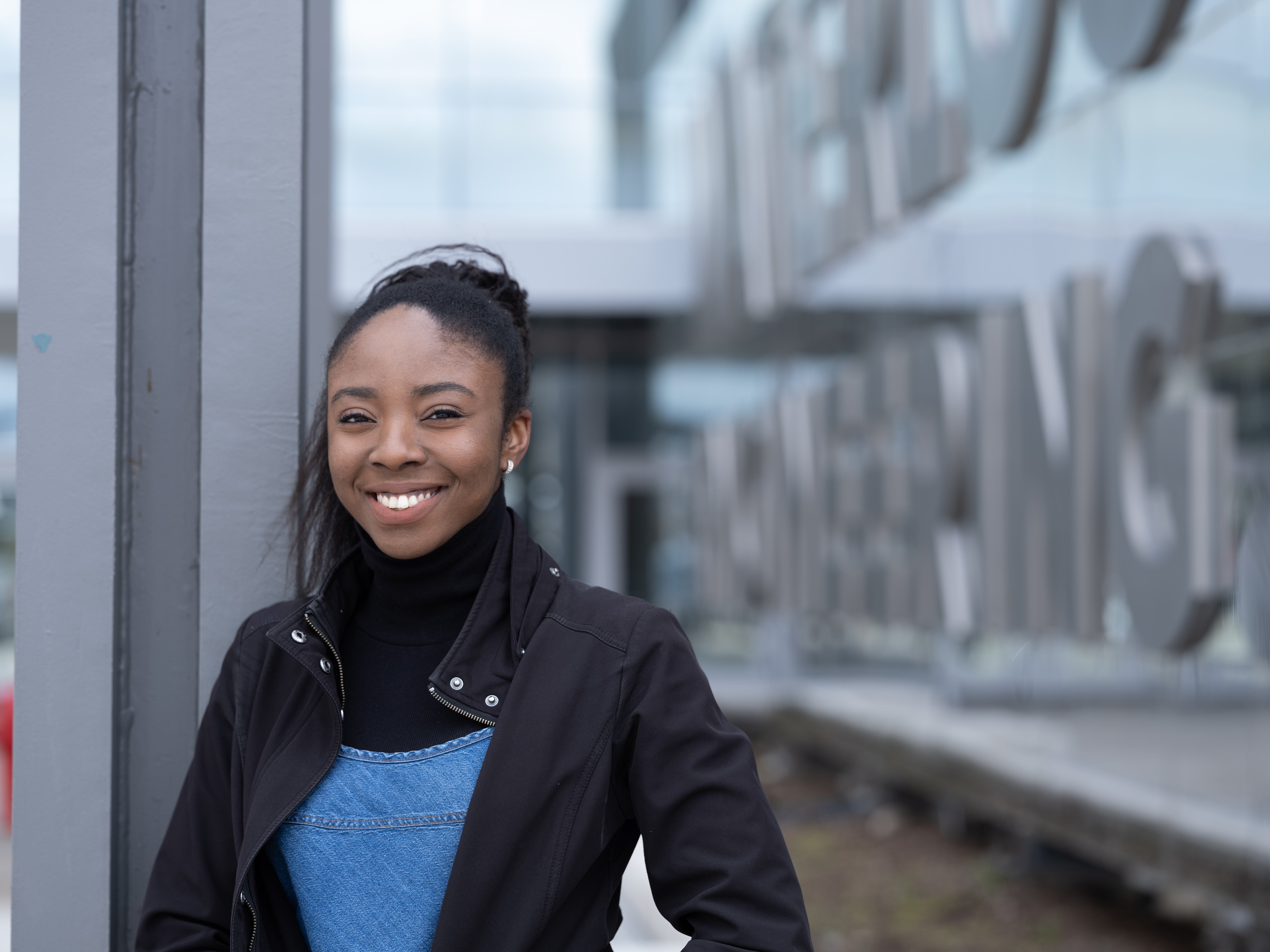 Student smiling outside