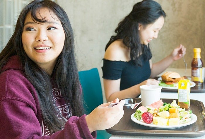University of Waterloo students with trays of food