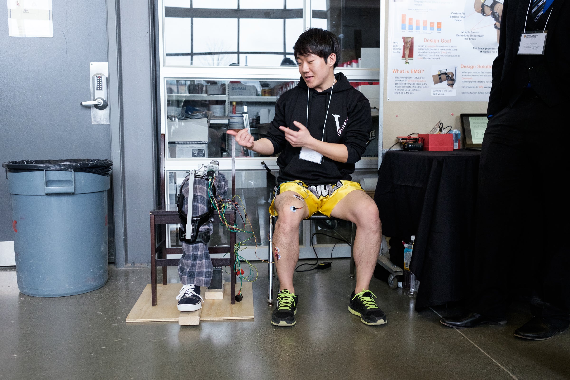 A student demonstrates the functionality of a prosthetic leg