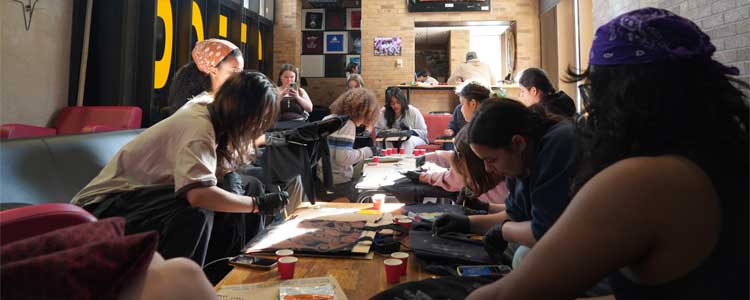 Group of Engineering students painting