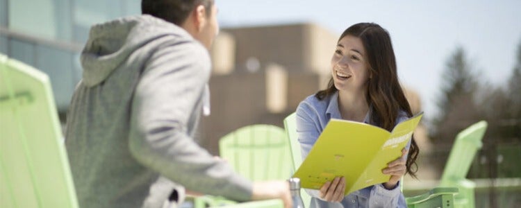 Students reviewing the Environment brochure.