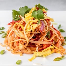 Plate with a heap of pasta in tomato sauce