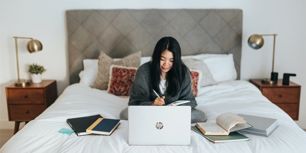 A student woking on her laptop.