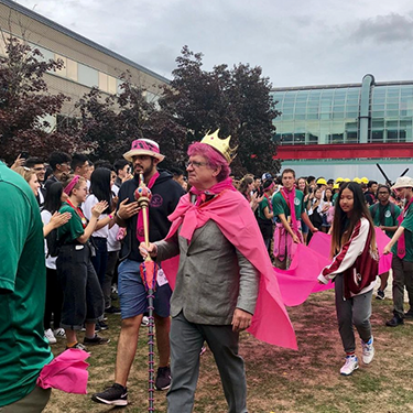 man with crown and sceptre at math orientation event