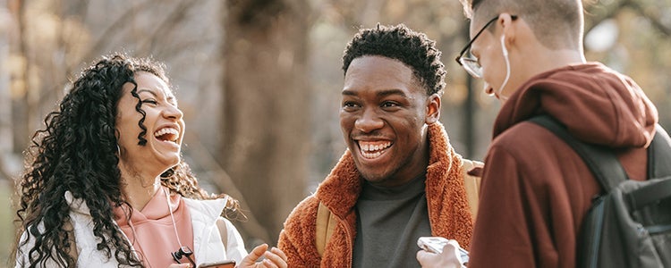 Three student talking and laughing