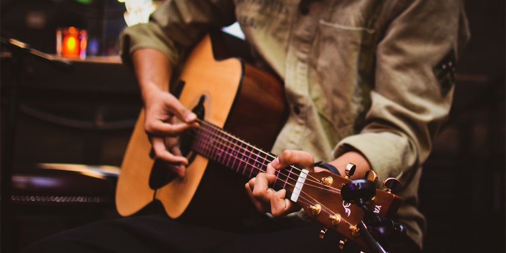 Person playing guitar.