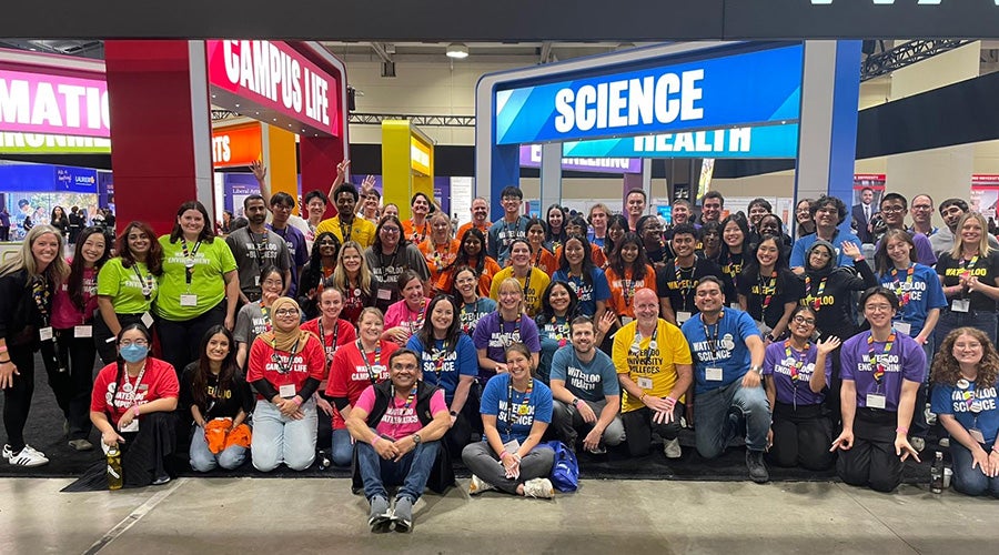 Waterloo staff and students at the Ontario Universities' Fair booth