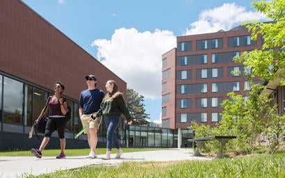 Student walking between residence buildings.