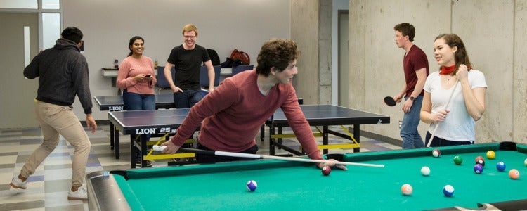 students playing pool