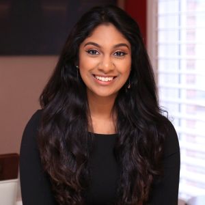 Sophia smiles for a professional headshot