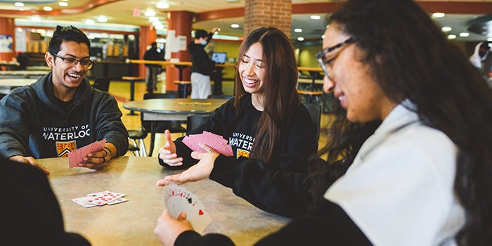 Group of students playing cards