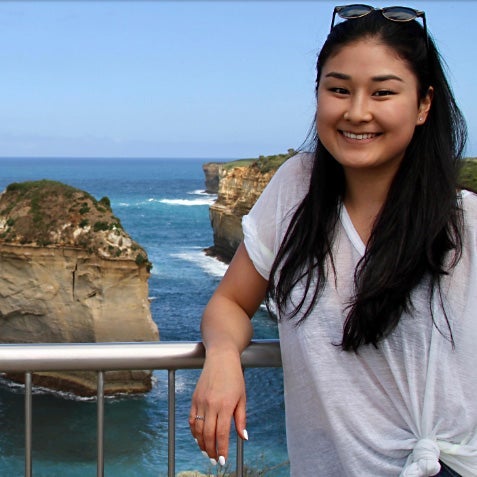 Student standing on the coast of Australia