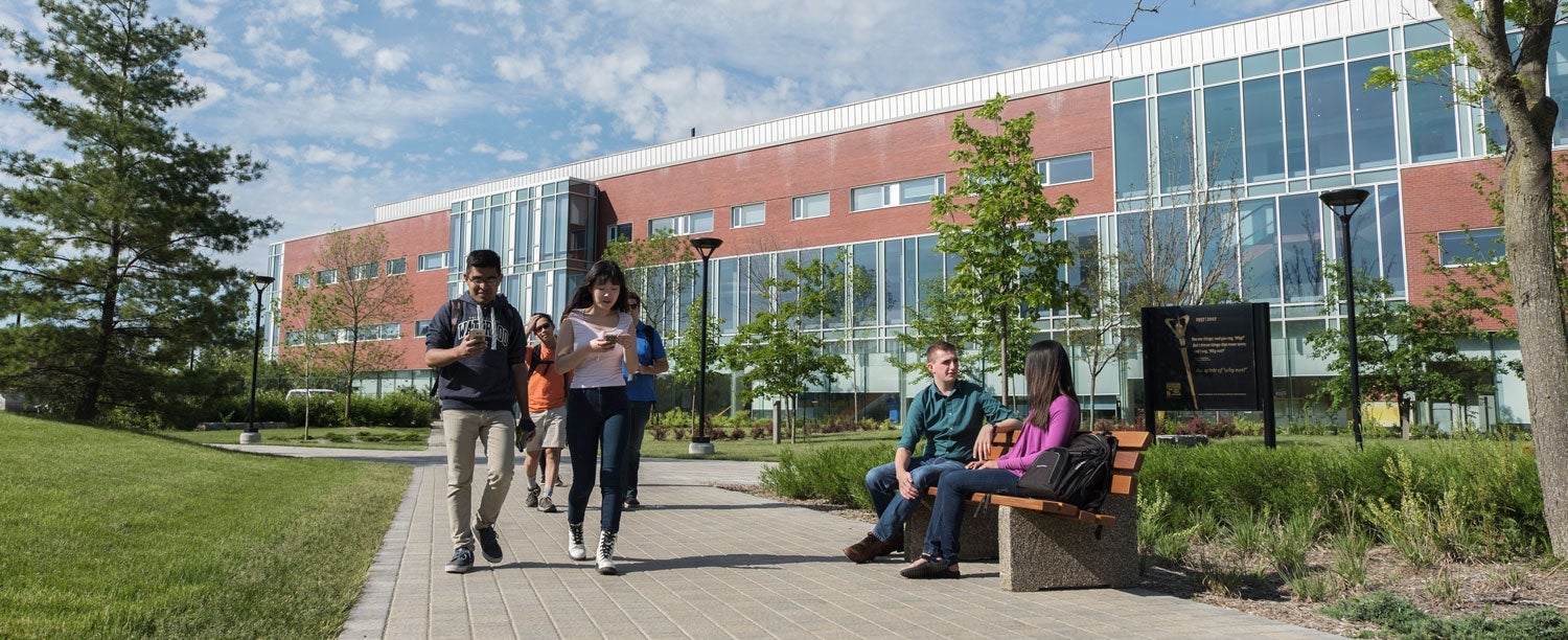 Students walking past the Tatham Centre at the University of Waterloo