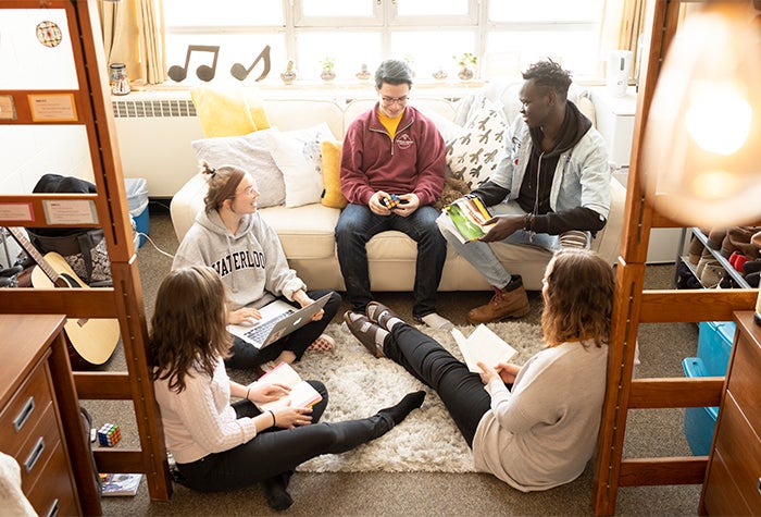 students sitting together in a dormitory 