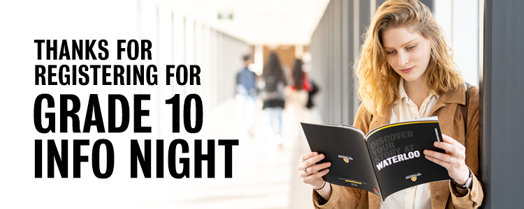 Student reading a University of Waterloo viewbook on campus. 