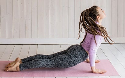 Student doing yoga.