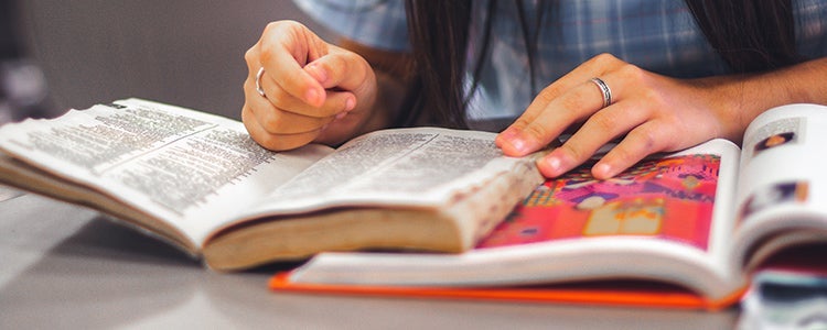 A student reading a textbook