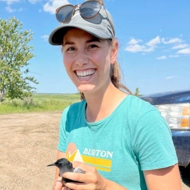 Zoe tagging a black tern bird while on a work term in western Canada.