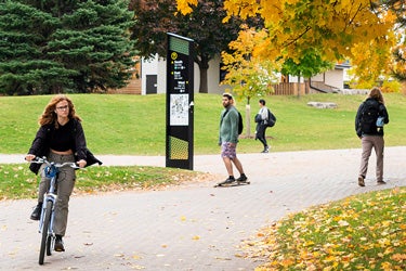 Students cycling and walking on campus