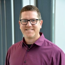 Headshot of Brian in well-lit space