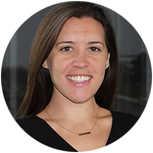 Clare Stevens has long brown hair and wears a black shirt