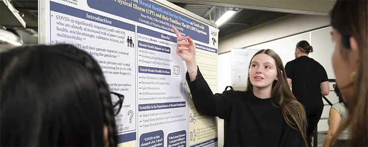 Kinesiology student presenting research.