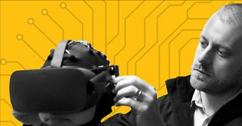 Dr. Michael Barnett-Coawn attaching a VR head