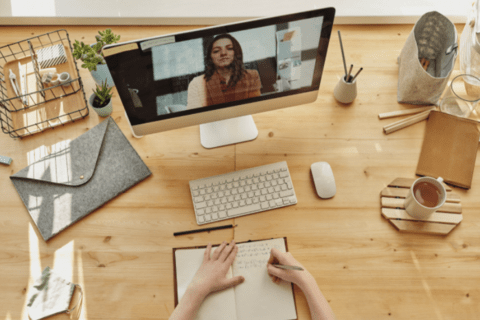 Working online video with a person on a screen (from Canva stock images)