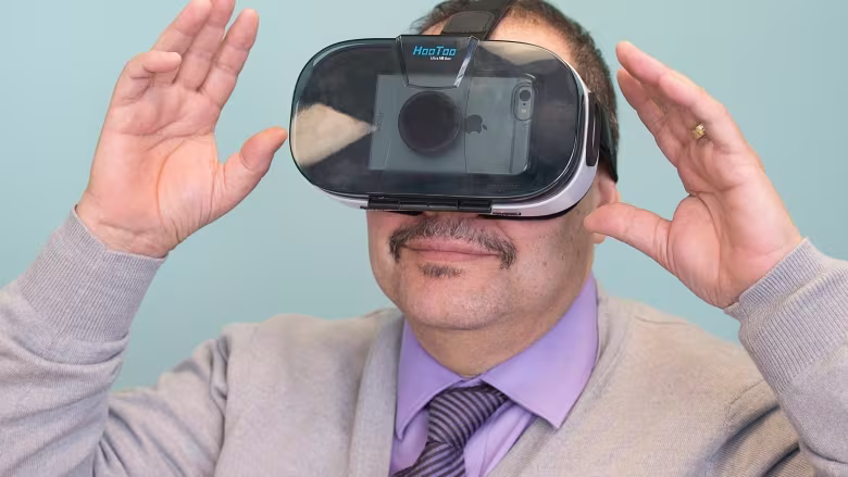 Gerry Morrison wearing a VR Headset