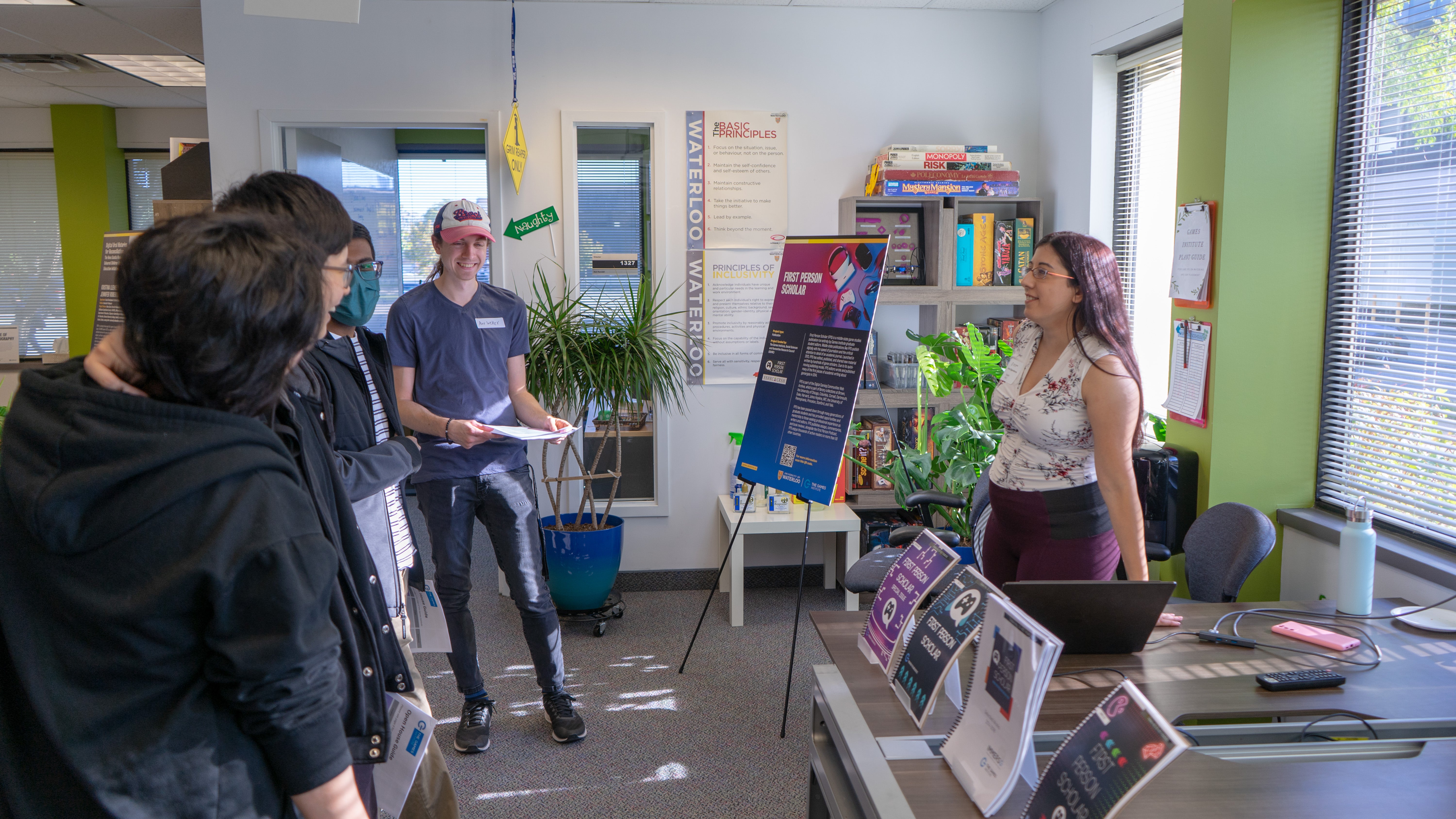 Visitors learning about First Person Scholar