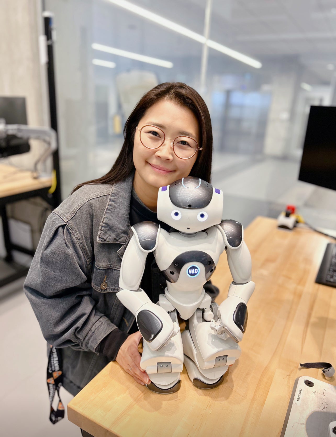 Jae Eun (Jen) Shin next to humanoid robot