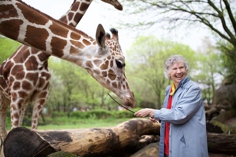 Anne Dagg with giraffe