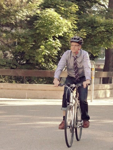 Markus Moos riding a bike on campus.