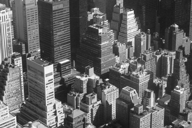 Aerial view of a skyline in grayscale.