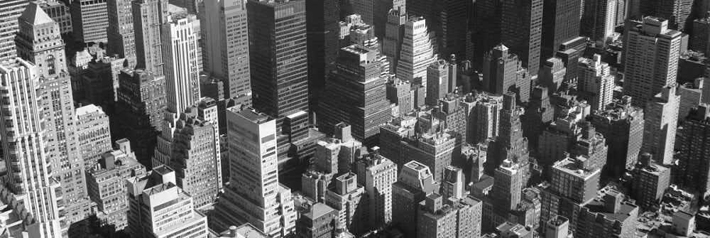 Aerial view of a skyline in grayscale.