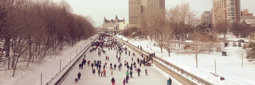 People skating on the Rideau Canal in the winter.