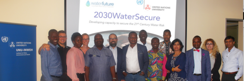 Multiple stakeholders, including experts from seven countries, stand alongside the 2030WaterSecure banner