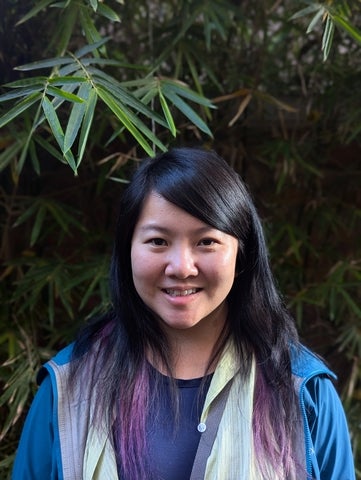 tara Chen wearing blue jacket, smiling at camera 